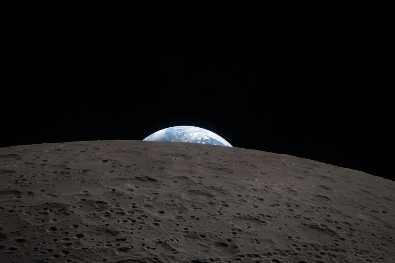 Earth setting behind the lunar horizon